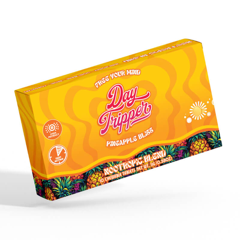 Yellow box with 'Day Tripper' branding and pineapple design on a white background.  Day Tripper pineapple magic Mushroom Tablets with blue lotus and mad honey.  