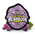 Package of TRE House Sour Grape Mushroom Gummies surrounded by grapes and gummies. 