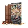A picture of Tre House Peanut Butter Mushroom Chocolate Bar against a smooth, creamy background, illustrating the rich peanut butter flavor combined with magic mushrooms for a powerful cognitive boost.